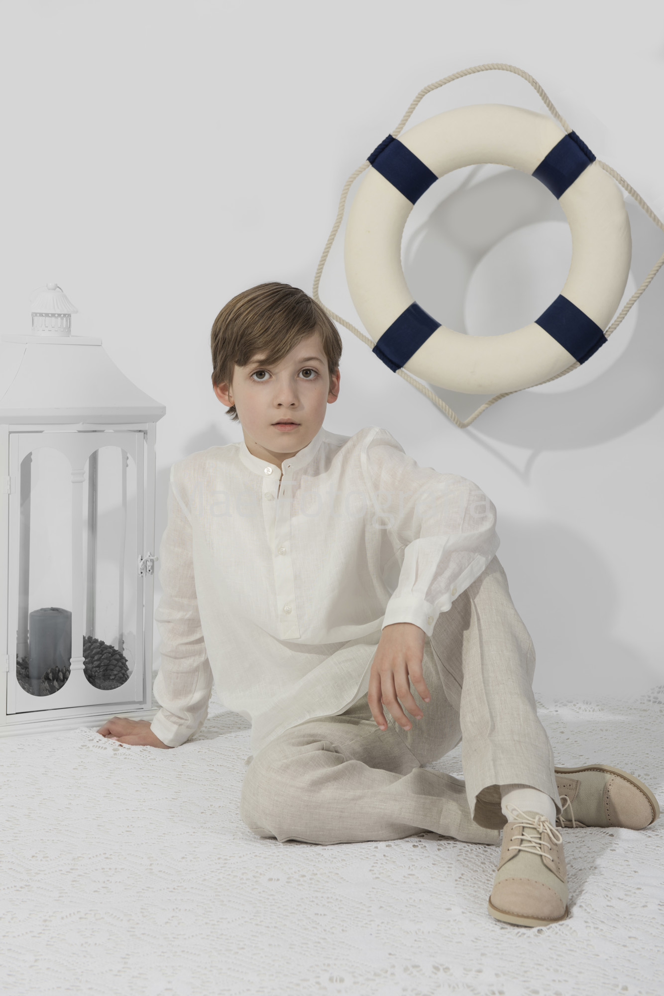 Foto de comunión con farolillo y salvavidas.